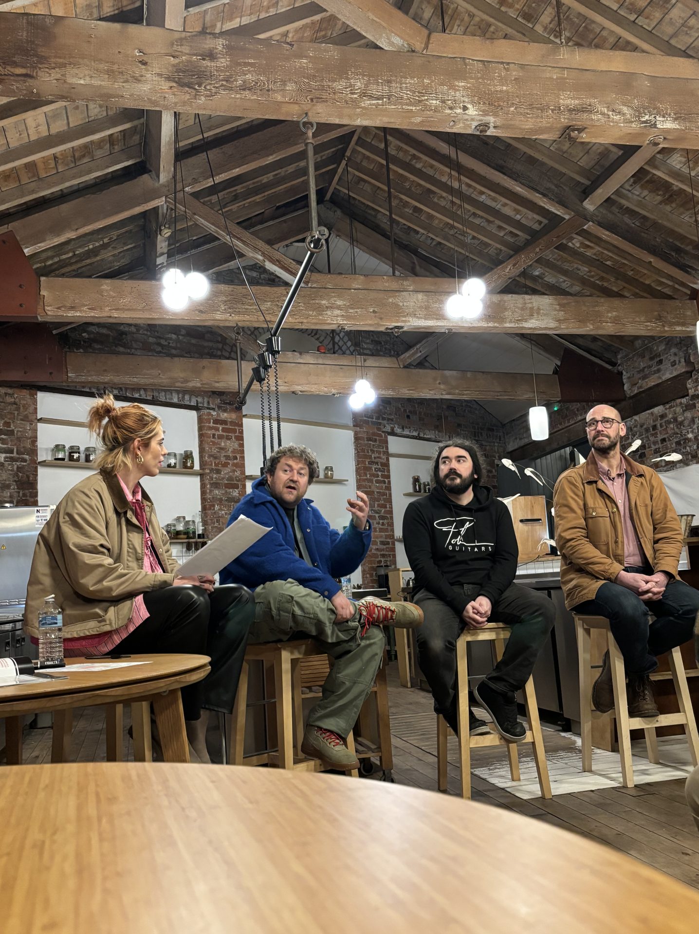 Panel speakers seated on stools inside Where The Light Gets In during the Crafted Futures “Heritage in a Modern World” event, discussing heritage, craft, and contemporary creativity beneath the venue’s rustic timber beams.